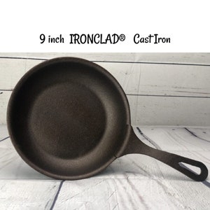 May include: A 9 inch IRONCLAD® Cast Iron skillet. The skillet is dark brown and has a smooth surface.