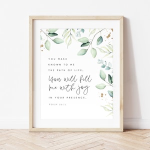 May include: A white printable art print with a watercolour background of green leaves and gold accents. The text reads "You make known to me the path of life: You will fill me with joy in your presence. Psalm 16:11"