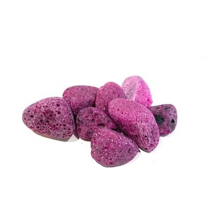 May include: A cluster of porous, oval-shaped pumice stones in shades of purple and pink. The stones have a rough, textured surface and are set against a white backdrop. These stones are often used for exfoliating the skin.