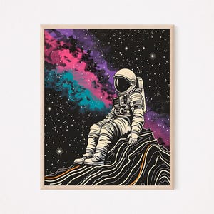 May include: An astronaut in a white spacesuit sits on a rocky surface against a backdrop of a dark, starry sky with pink and blue nebulae.