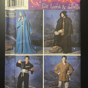 May include: A Simplicity sewing pattern envelope for costumes for teens and adults, number 5840, size A XS, S, M, L, XL. The cover displays four costume variations: a blue hooded robe, a black hooded cloak, a black tunic with a silver sash, and a brown tunic.