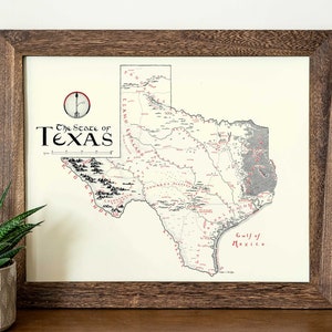 May include: A vintage-style map of the state of Texas, framed in a dark wood frame. The map is printed on cream-colored paper and features black and gray lines and text. The title "The State of Texas" is printed in red at the top of the map.