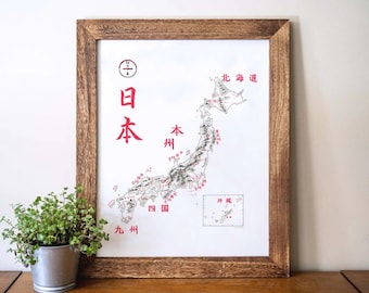 Peut inclure: Une carte encadrée du Japon avec du texte rouge et une boussole dans le coin supérieur gauche. La carte montre les différentes préfectures du Japon, y compris Hokkaido, Honshu, Shikoku et Kyushu. Le texte sur la carte est en japonais.