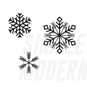 May include: Three black snowflake designs on a white background. The snowflakes are different sizes and styles. The text "SIMPLE MODERN" is in white and slightly transparent behind the snowflakes.