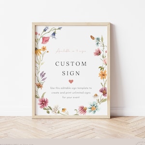 Könnte beinhalten: Eine druckbare Schildvorlage mit einem floralen Kranzrand. Das Schild lautet "Erhältlich in 4 Größen" und "Individuelle Beschilderung". Der Text "Verwenden Sie diese editierbare Schildvorlage, um unbegrenzt viele Schilder zu erstellen und zu drucken, für Ihre Veranstaltung" befindet sich unter dem Schild.