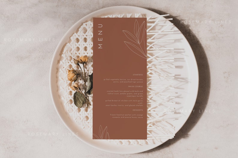 May include: A brown menu card with a white outline of leaves on the top and bottom. The text "MENU" is in white at the top of the card. The card is on a white plate with a woven pattern. The text on the card reads: "STARTERS", "Grilled asparagus, lemon, and red tomato pesto, and pan-fried tiger prawns", "MAIN COURSE", "Roasted duck leg glazed with herb and walnut crust, potato gratin and green asparagus bundles", "Grilled breast of chicken put with garlic, pearl barley risotto, and glazed chestnuts", "DESSERTS", "Fresh berries and yogurt with orange segments and honey bee sauce".