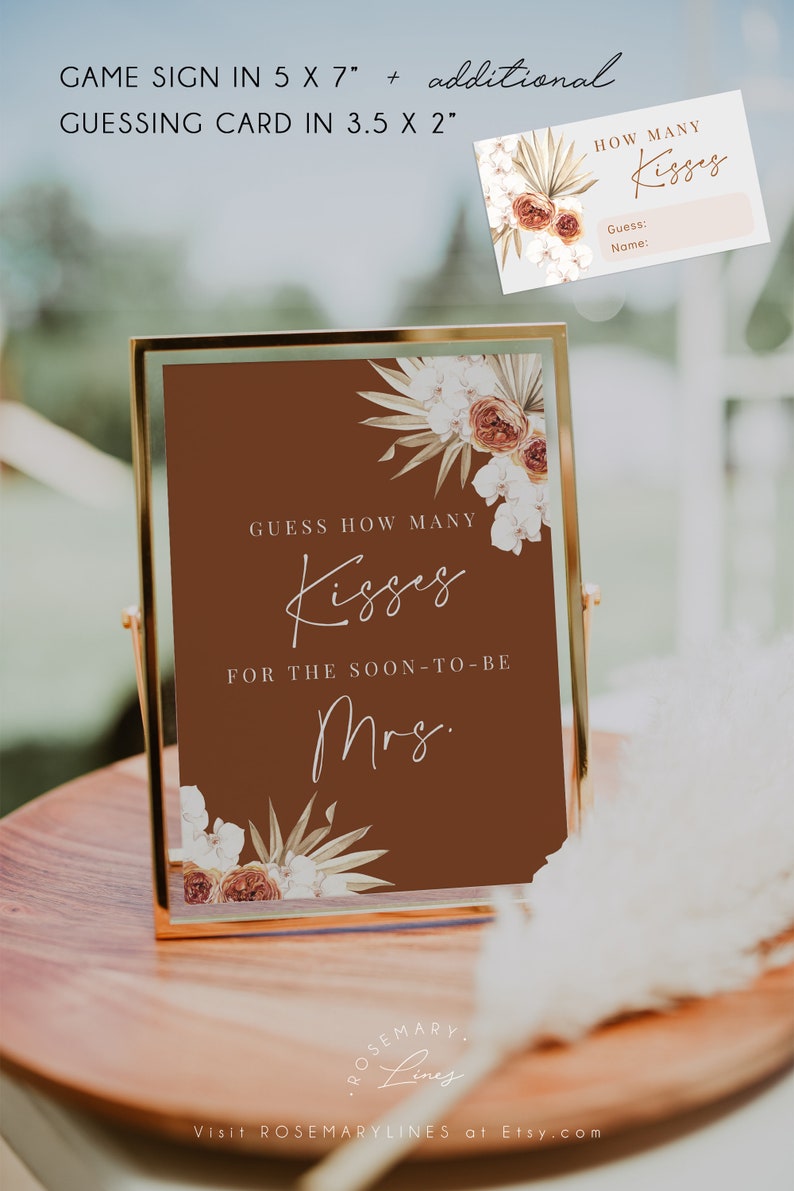 May include: A framed sign and a small card for a bridal shower game. The sign is 5 x 7 inches and features the text "Guess How Many Kisses" on a brown background, with floral accents. The card is 3.5 x 2 inches.