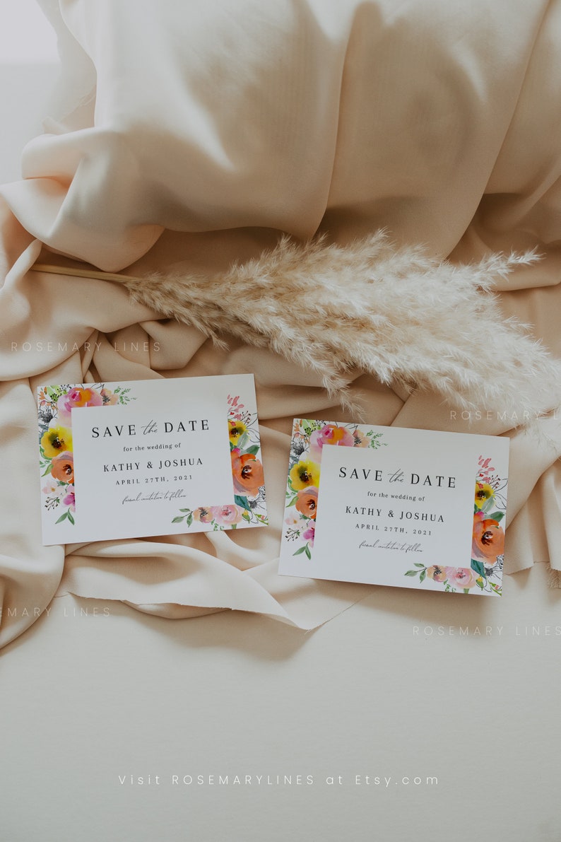 May include: Two save the date cards with floral borders. The cards are white with black text. The text reads "Save the Date" for the wedding of Kathy & Joshua, April 27th, 2021. The floral borders are watercolour style with pink, yellow, orange, and green flowers.