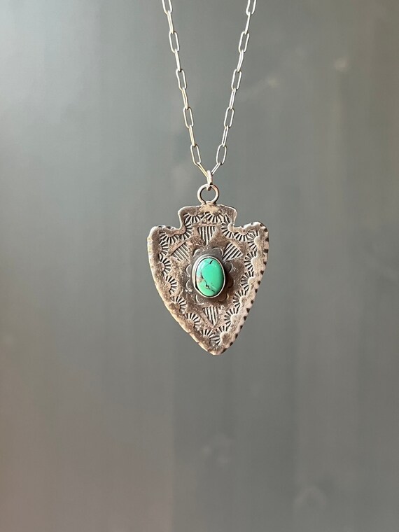 Turquoise arrowhead hotsell pendant