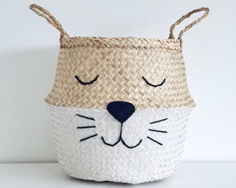 Large seagrass belly basket -With a painted white bottom and adorable animal face with whiskers. Perfect as a toy storage basket