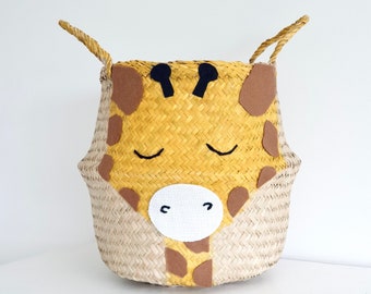 Large giraffe seagrass belly basket with a hand painted and embroidered face. In a yellow mustard colour