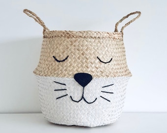 Large seagrass belly basket -With a painted white bottom and adorable animal face with whiskers. Perfect as a toy storage basket