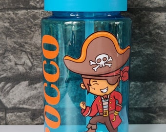 May include: A translucent blue plastic water bottle with a bright blue lid and a clear straw. The bottle features the name ROCCO in large orange vertical letters and a colorful graphic of a cartoon pirate standing on a treasure chest.