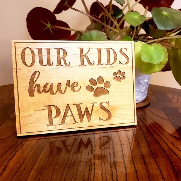 Our Kids Have Paws unique laser engraved plaque. Free standing. Made from Canadian maple.