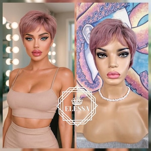 May include: A short, dusty rose-coloured wig with a pixie cut. The wig is styled with a side part and a slightly tousled texture. The wig is displayed on a mannequin head with a pearl necklace. The image also includes a woman wearing a beige crop top and skirt.