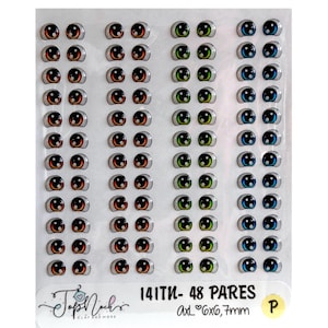 May include: A sheet of 48 pairs of colorful plastic doll eyes. The eyes are arranged in four columns of 12 pairs each. The eyes are various shades of orange, green, and blue. The sheet is labeled "141TW - 48 PARES Axl 6x6, 7mm P".