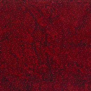 May include: A red fabric with a scattered pattern of small, dark red dots.