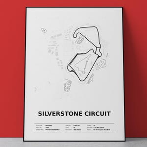 May include: A framed poster featuring a black line drawing of the Silverstone Circuit track layout on a white background. The text reads Silverstone Circuit, with details including location, year, grand prix, length, laps, race distance, turns, record, and pilot.