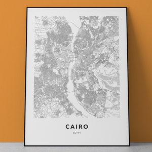 May include: A black and white map print of Cairo, Egypt. The map shows the city's streets and waterways. The city name "Cairo" and "Egypt" are printed below the map.