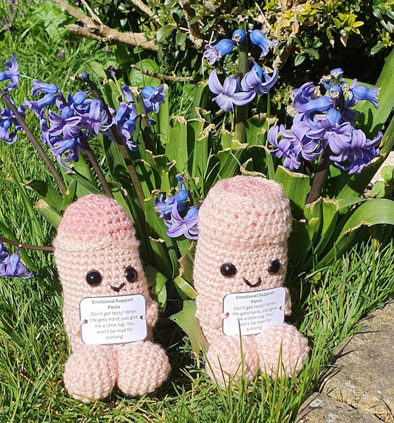 A hand-crocheted penis plushie marketed as 'emotional support' — absurdly committed to the bit and genuinely handmade.