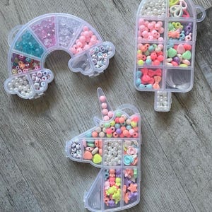 May include: A set of three ceramic mugs with a speckled, matte finish. The mugs are in shades of cream, light gray, and dark gray. Each mug has a simple, minimalist design and a rounded handle. The mugs are suitable for coffee, tea, or other beverages.