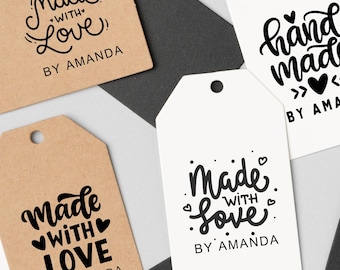 May include: Four white and brown rectangular tags with black text. The tags have the text "Made with Love" and "By Amanda" on them. One tag also has the text "Hand Made".