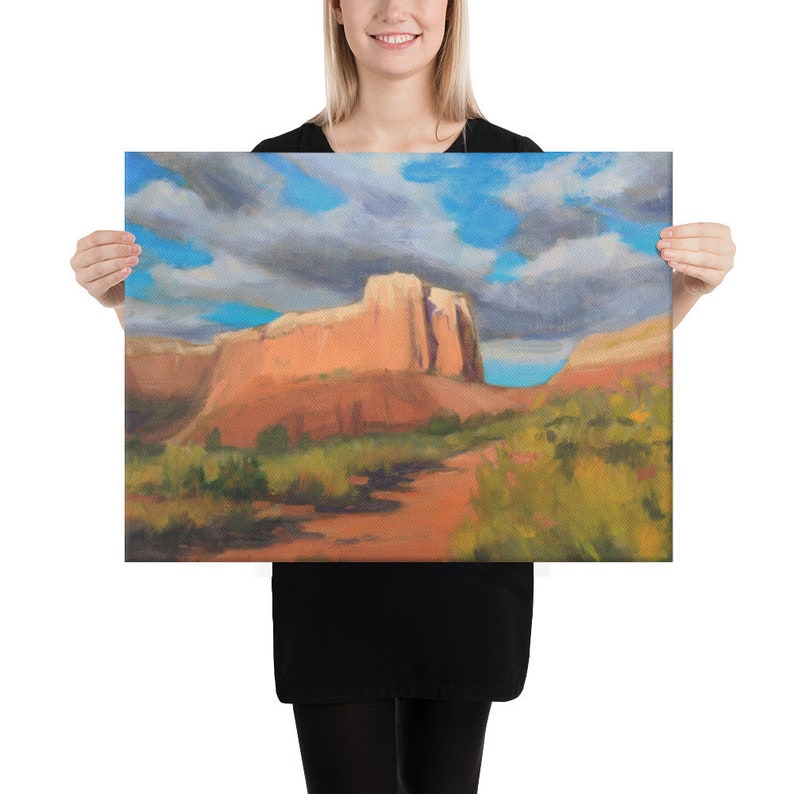May include: A painting of a red rock formation in a desert landscape. The sky is blue with white clouds. The painting is done in a realistic style.