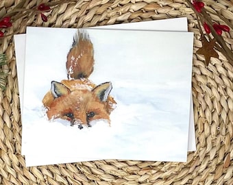 雪の中で遊ぶキツネのカード – 手描きの冬の野生動物アート