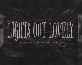 May include: A digital graphic featuring the text LIGHTS OUT LOVELY in a stylized, serif font in light purple, with the smaller text A TYPEFACE BY THE OCTOBER CREATIVE below it, all set against a dark, textured, crinkled black plastic background.