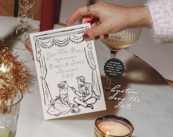 May include: A rectangular white card featuring a black ink illustration of a couple with a curtain border. The text reads Save The Date for the wedding of Darla & James on the evening of 11-20-27. A small black circular tag with white text is attached.