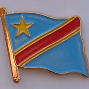 May include: A gold-coloured pin with a blue background and a yellow star. The pin has a red and gold stripe across the blue background.