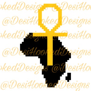 May include: A black silhouette of the continent of Africa with a gold Ankh symbol superimposed over it.