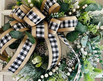 Farmhouse, Rustic country, white and black buffalo plaid Christmas front door flocked wreath with white berries and a bow.