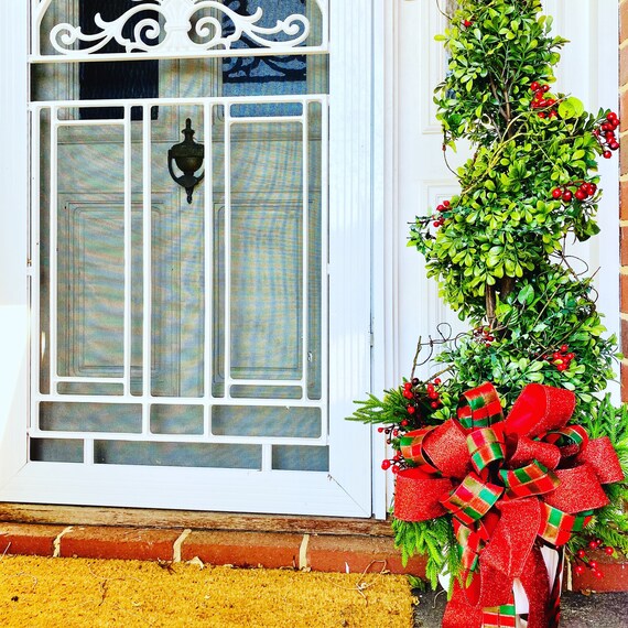 Christmas Topiary For Front Entrnace Red Strand Lights Red Berries Mixed Faux Greenery And Pine Cones In A White Urn