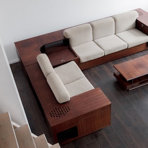 Luxury Italian corner sofa with record player and rosewood shelves integrated Palm Springs lifestyle