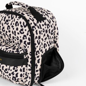 Womens stylish leopard print camera bag, stylish camera backpack for women, leopard print has a matching leopard print camera strap