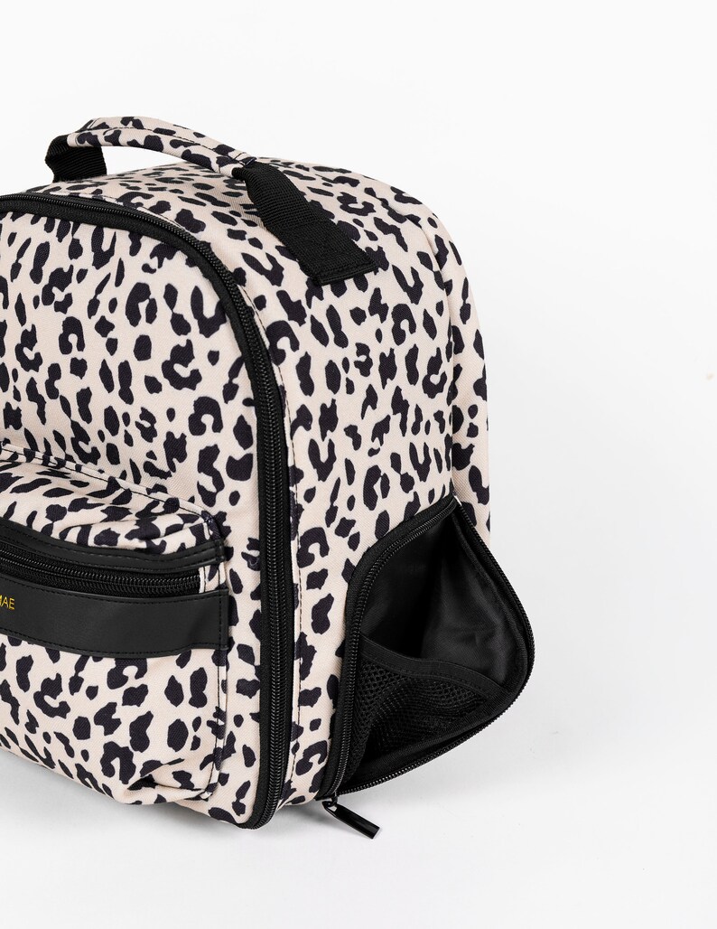 Womens stylish leopard print camera bag, stylish camera backpack for women, leopard print has a matching leopard print camera strap