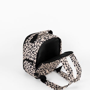 Womens stylish leopard print camera bag, stylish camera backpack for women, leopard print has a matching leopard print camera strap