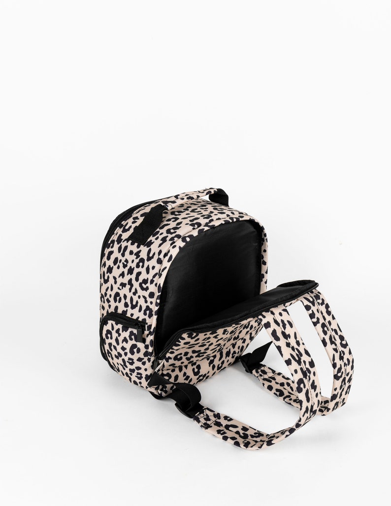 Womens stylish leopard print camera bag, stylish camera backpack for women, leopard print has a matching leopard print camera strap