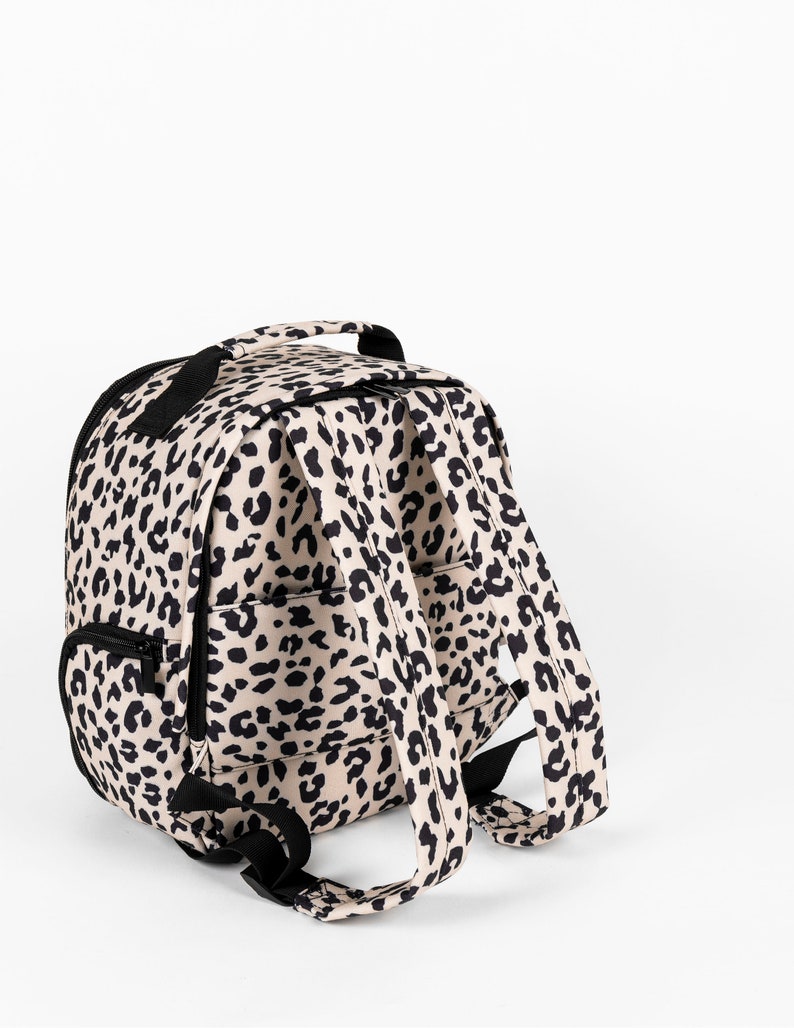 Womens stylish leopard print camera bag, stylish camera backpack for women, leopard print has a matching leopard print camera strap