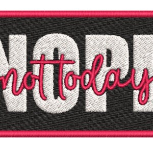 May include: Embroidered patch with the word "NOPE" in large white block letters, with "not today" in cursive pink script. The patch has a black background and a pink border.