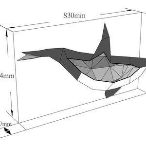 May include: A black and white origami orca whale sculpture, 830 mm wide, 494 mm tall, and 87 mm deep.