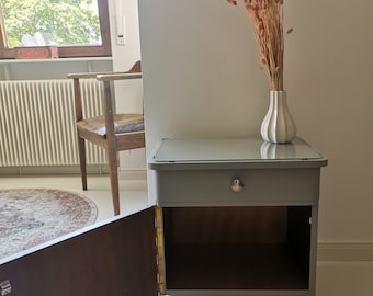 Gray 70s bedside table with glass top