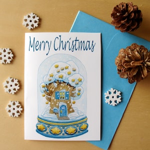 Biglietto di buon Natale ad acquerello con albero abitato natalizio dentro la palla di neve, biglietto d'auguri con palla di neve azzurra