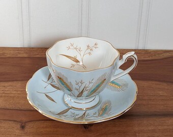 Queen Anne Teacup and Saucer, Blue and Golden Wheat Pattern