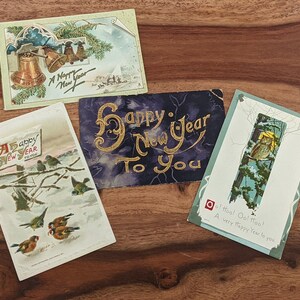 Antigüedades 4 Año Nuevo, tarjetas de felicitación / postales, álbum de recortes, efímero, un Raphael Tuck & Sons, impreso en Sajonia y EE. UU., principios de 1900
