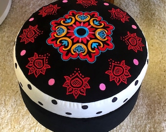Round ottoman with embroidery, pouffe, footstool
