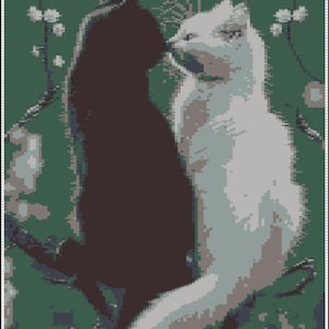 May include: A black cat and a white cat nuzzle each other in front of a green background with white blossoms.
