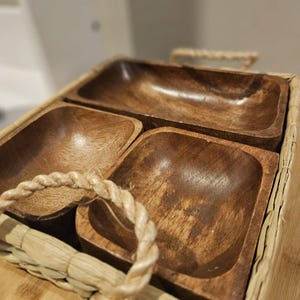 Pretty wood bowls in basket tray