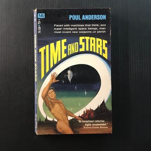 May include: Vintage paperback book titled "Time and Stars" by Poul Anderson. The cover features a man reaching towards a white oval with a dark blue and green background. The book has text that reads "An exceptional collection... highly recommended." Science Fiction Review.